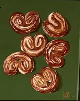 Pintura de orejas de hojaldre sobre fondo verde, colgada en la tienda
